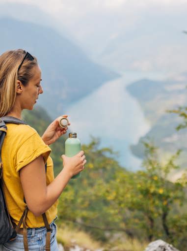 Hiking Woman With Water Bottle Getty (1)